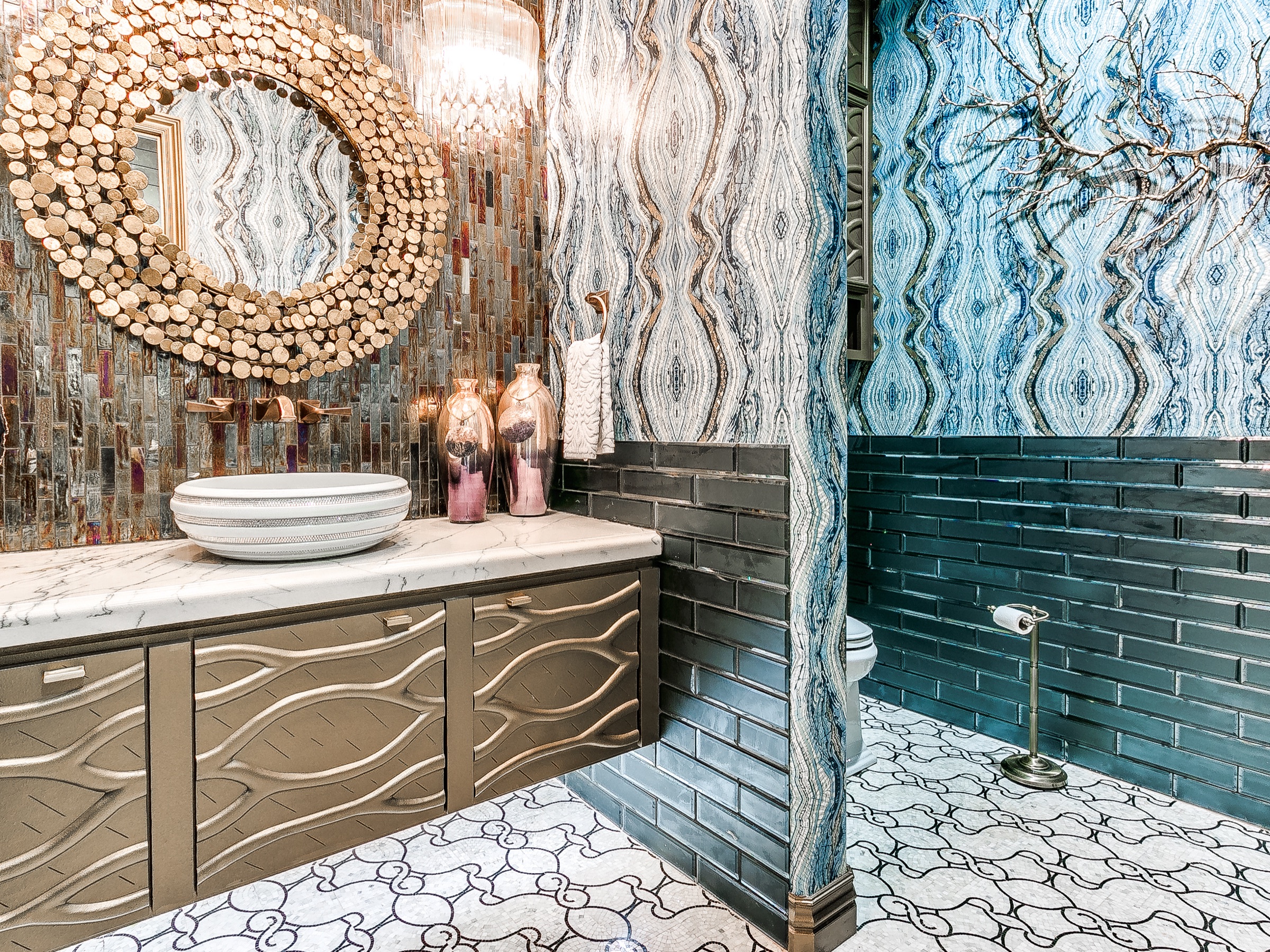 Luxury bathroom with ornate mirror and custom tilework