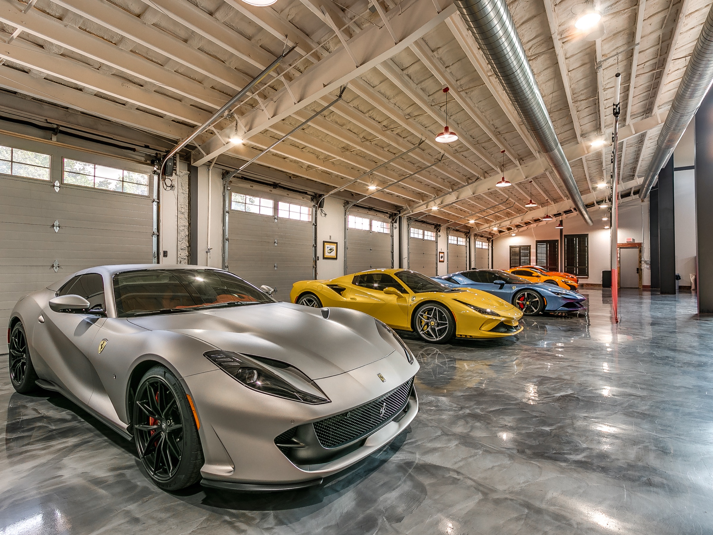 Private car collection — four exotic Ferraris in the garage