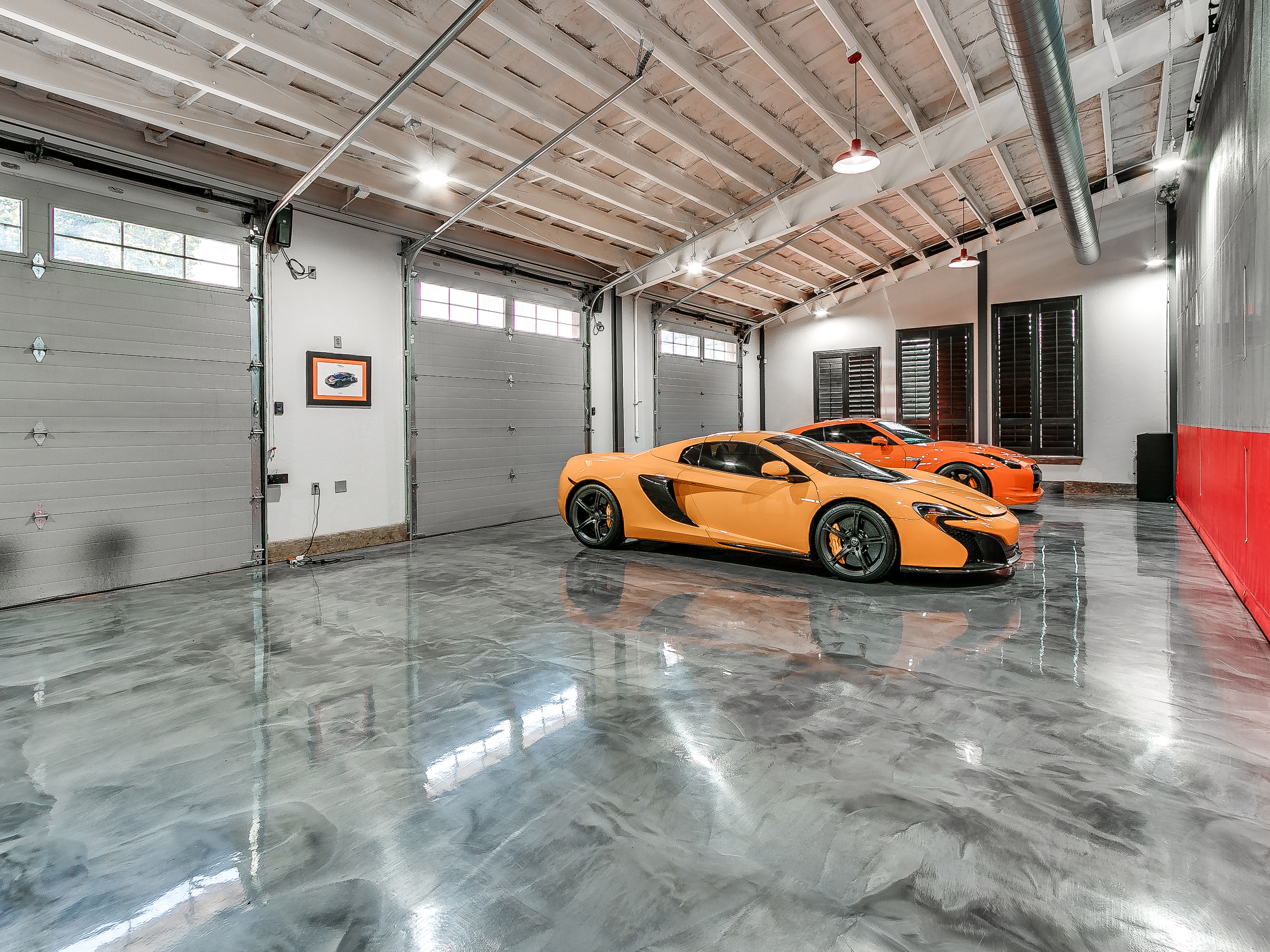 Orange McLaren supercar in private garage